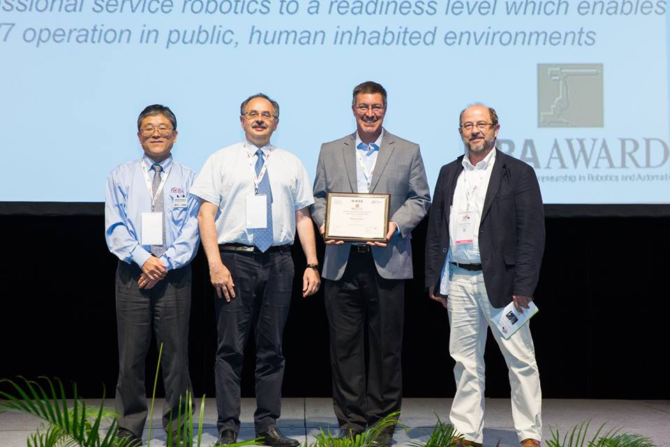 from left to right: Satoshi Tadokoro, IEEE-RAS President; Arturo Baroncelli, past IFR President; Steve Cousins, CEO Savioke; Erwin Prassler, IEEE-RAS Vice President